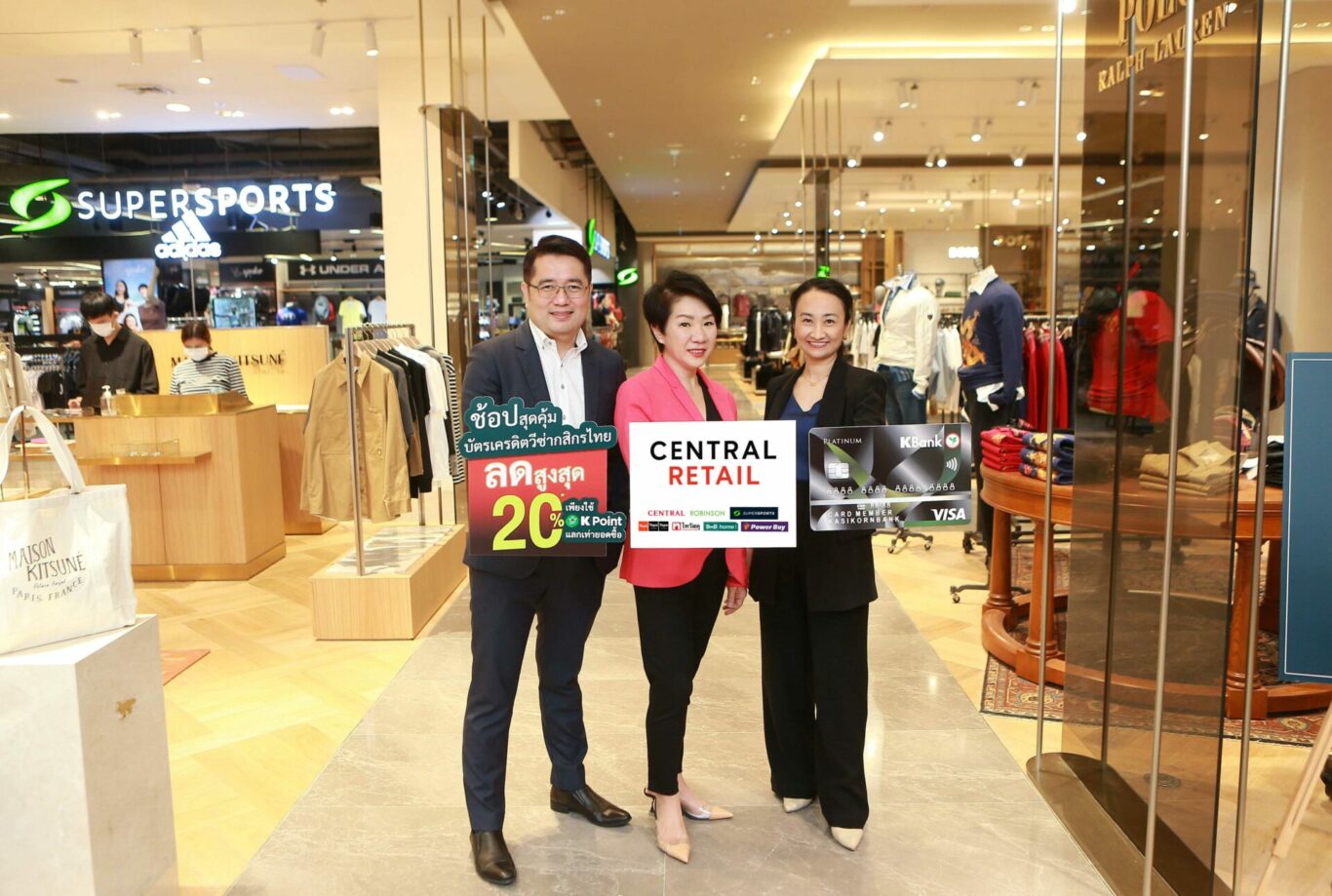 A group of people holding a sign
Description automatically generated