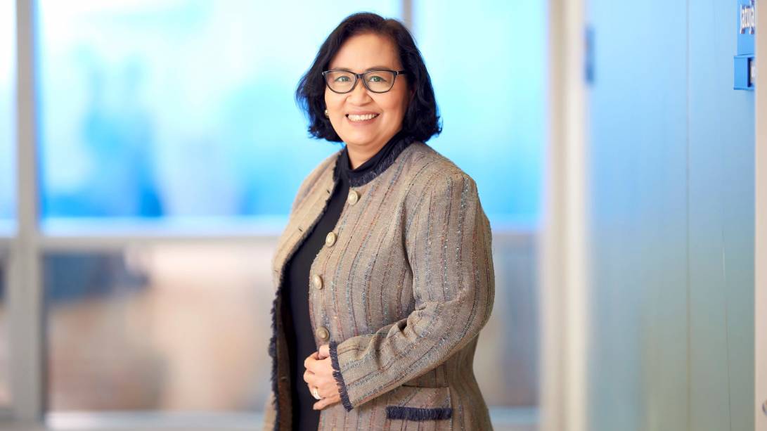 A person smiling at camera

Description automatically generated