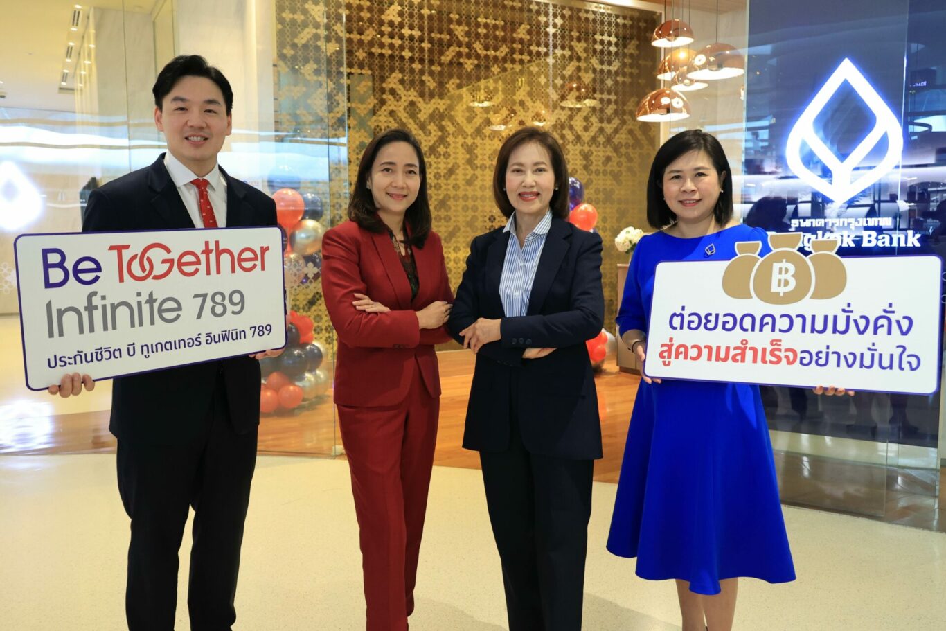 A group of people holding signs

Description automatically generated