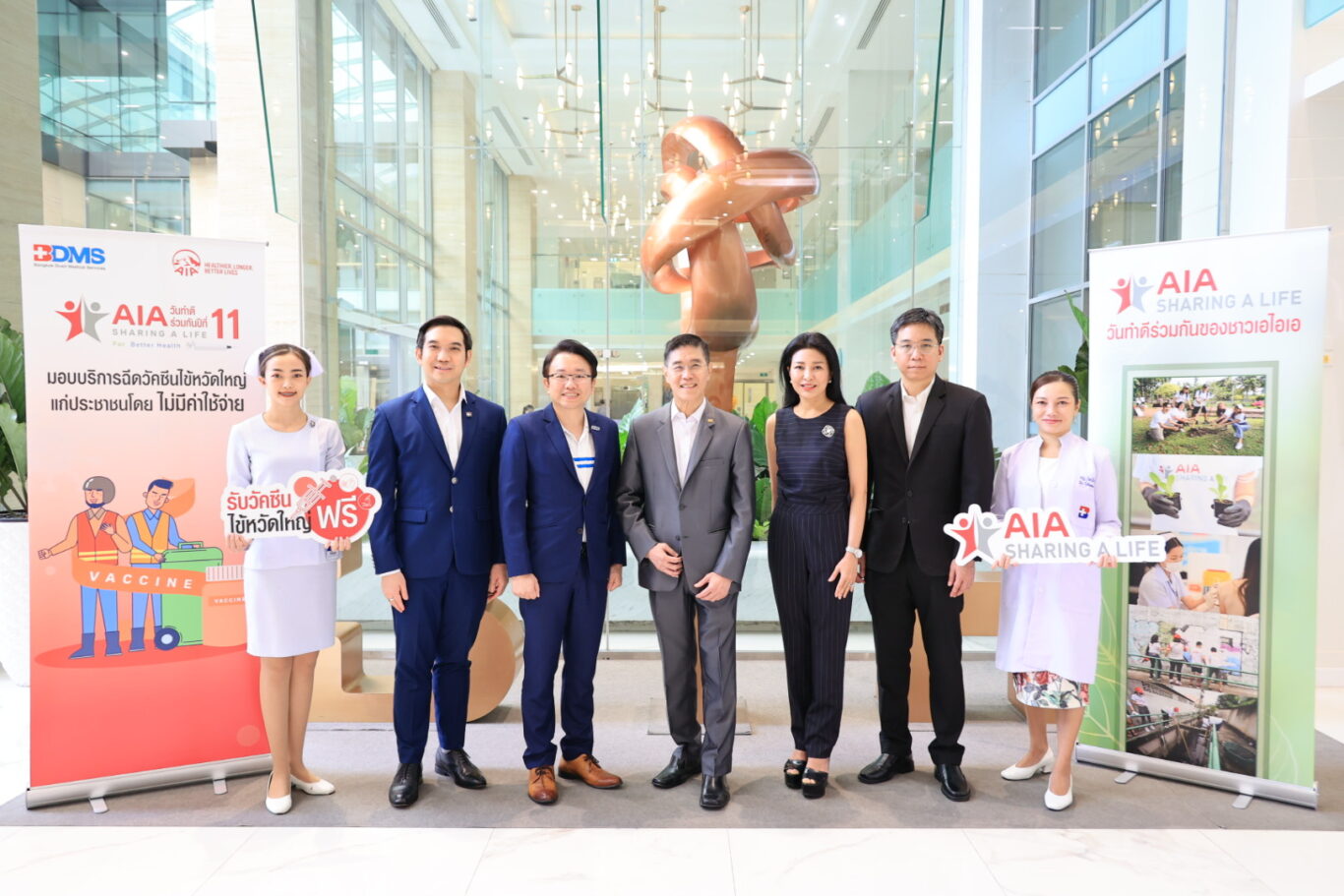 A group of people posing for a photo

Description automatically generated